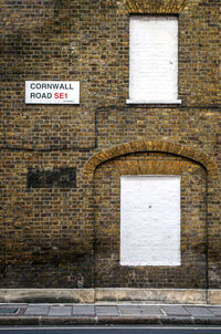 Information sign on brick wall