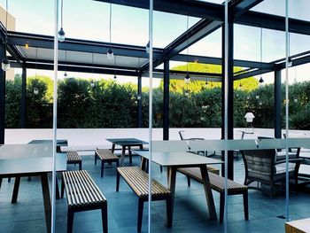 Empty chairs and tables in restaurant