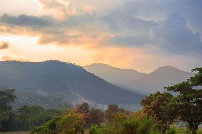 Scenic view of mountains against sky during sunset