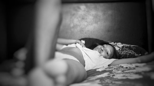 Woman sleeping on bed
