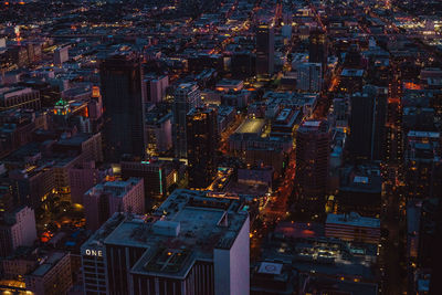 Aerial view of city lit up at night