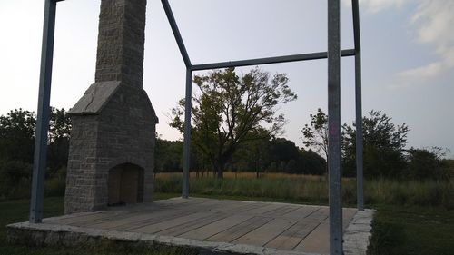 Built structure on field against sky