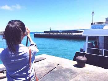 Rear view of woman looking at sea