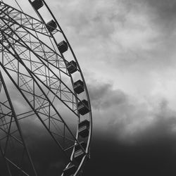 Low angle view of ferris wheel against sky