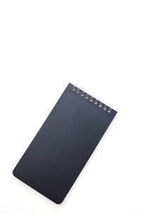 High angle view of book against white background