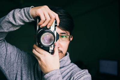 Portrait of man photographing