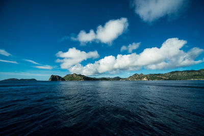 Scenic view of sea against blue sky