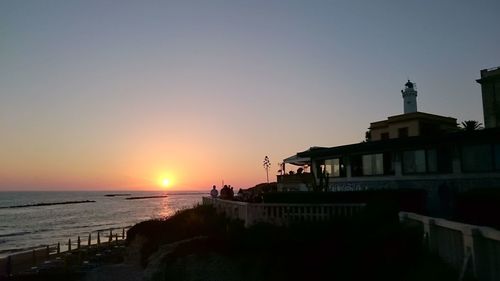 Scenic view of sea against clear sky during sunset