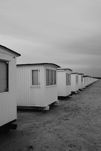 Built structure on beach against sky