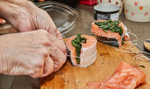 Cropped hand of person preparing food