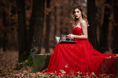 Portrait of a beautiful young woman in forest