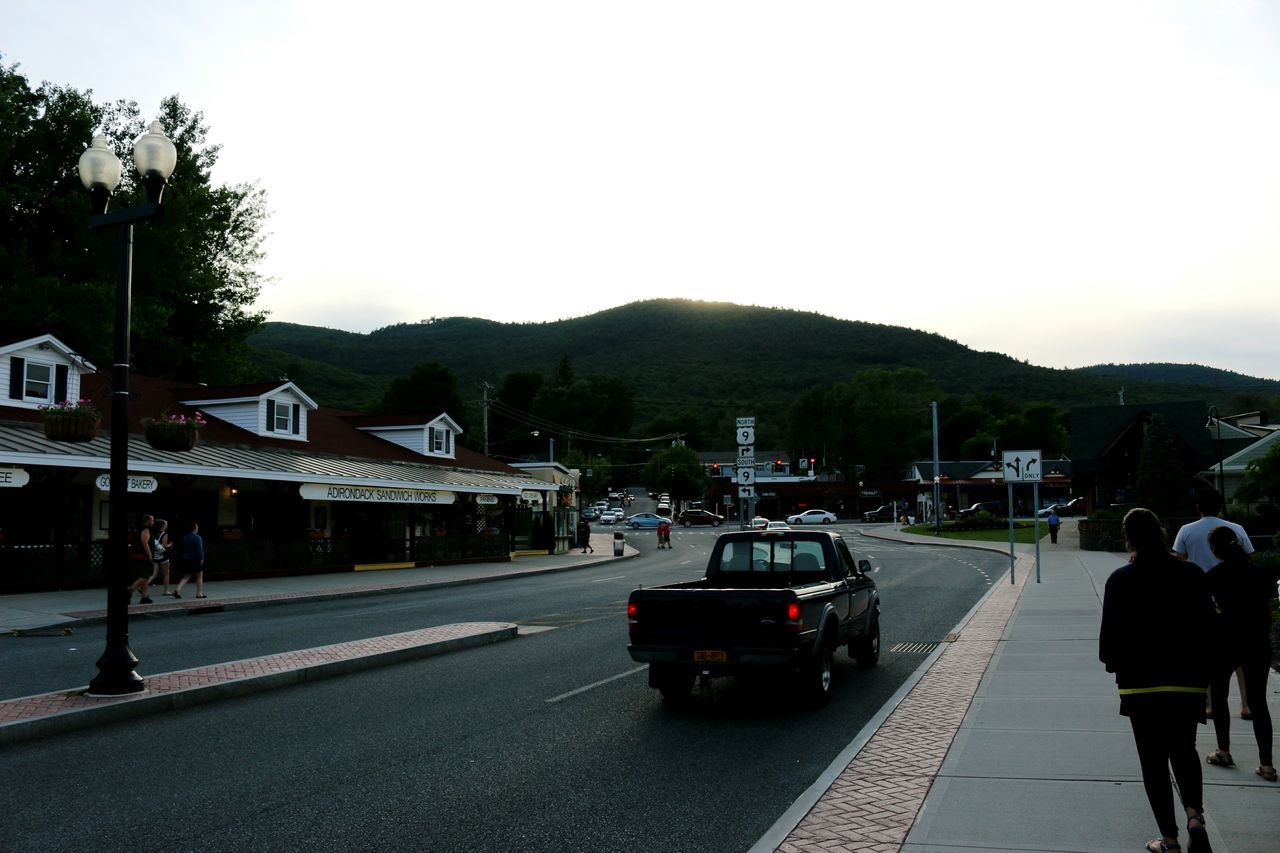 PEOPLE WALKING ON ROAD