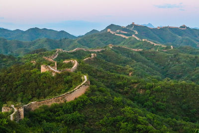 High angle view of green landscape against sky