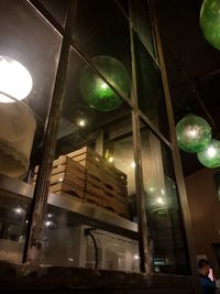 Low angle view of illuminated balloons at night