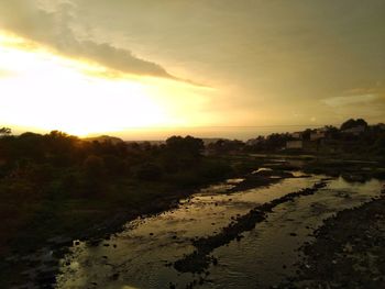 Scenic view of landscape against sky during sunset