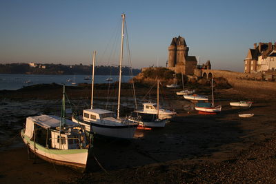 Boats moored at harbor