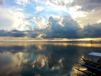 Scenic view of sea against cloudy sky