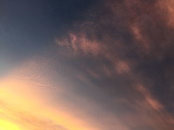 Low angle view of clouds in sky during sunset