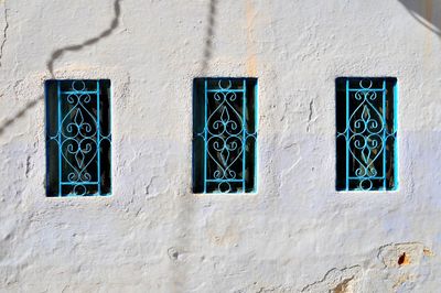 White wall and blue windows