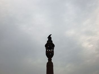 Low angle view of bell tower against sky