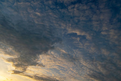 Low angle view of dramatic sky during sunset