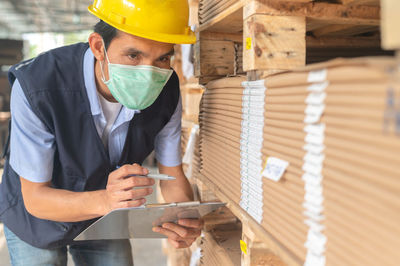 Young man working in factory