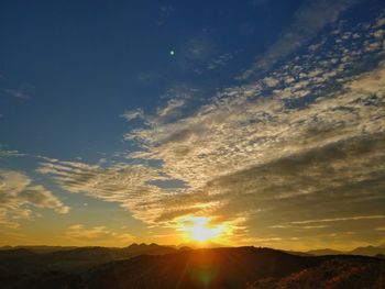 Low angle view of mountains against sky during sunset