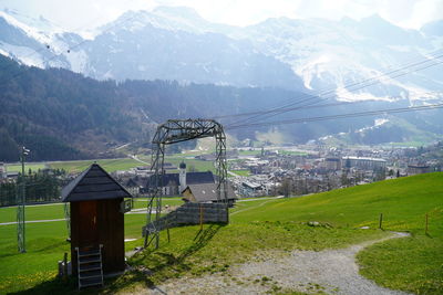 Built structure on field against mountains