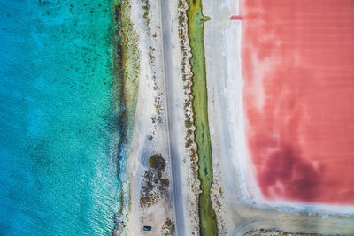 Aerial view of sea by land