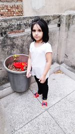 Portrait of cute girl standing outdoors