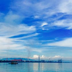 Scenic view of sea against cloudy sky