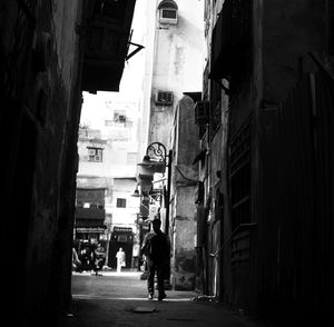 Alley amidst buildings in city