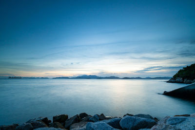 Scenic view of sea against sky at sunset