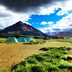 Scenic view of landscape against cloudy sky