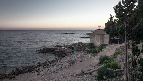 Scenic view of sea against clear sky during sunset