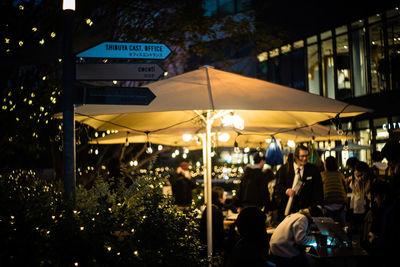 Group of people in restaurant at night