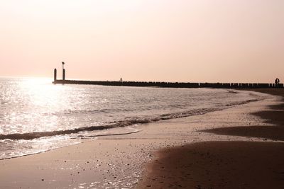 Scenic view of sea against clear sky during sunset