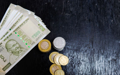 High angle view of coins on table