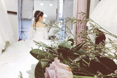 Close-up of woman holding flowers