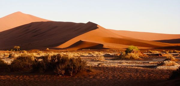 Scenic view of desert against clear sky