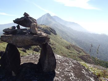 Scenic view of rocks on mountain against sky
