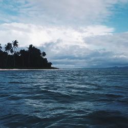 Scenic view of sea against cloudy sky