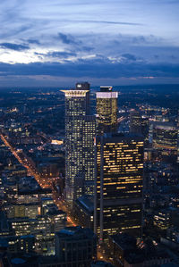 Illuminated cityscape against sky