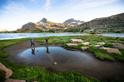 Couple hiking together at limestone lakes height of the rockies