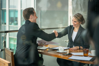 Young woman with text on table