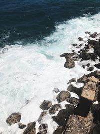 High angle view of waves on shore