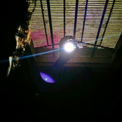 Low angle view of illuminated lighting equipment