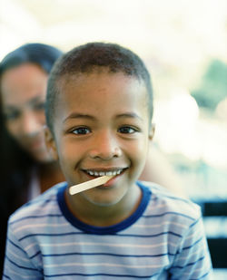 Boy with ice lolly stick