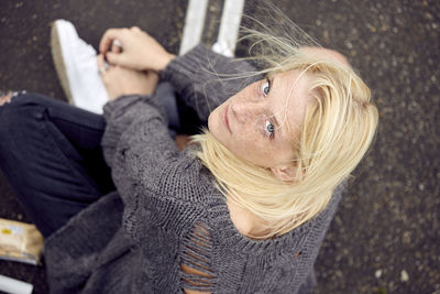 High angle portrait of woman relaxing outdoors