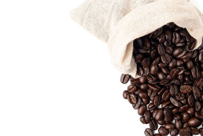 Close-up of coffee beans against white background